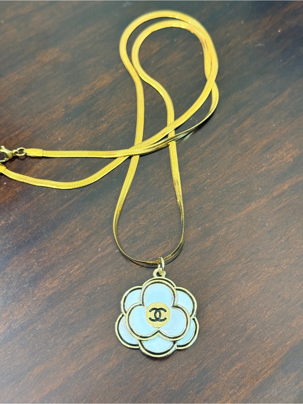 Chanel EUC Camellia enamel 
Flower charm on 22” Serpentine
304 stainless chain